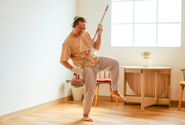 man-having-fun-while-cleaning-house-2023-11-27-04-55-59-utc
